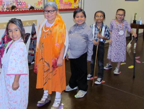 Several Soboba kindergarten students walk along the 100 footprints, dressed as a "100-year-old" person as the class celebrated its 100th day of instruction. From left, Analicia Placencia, Tuupash Arviso, Joseph Arres, Ete'tish Suun Arviso and Noyáaykit Silvas Several Soboba kindergarten students walk along the 100 footprints, dressed as a "100-year-old" person as the class celebrated its 100th day of instruction. From left, Analicia Placencia, Tuupash Arviso, Joseph Arres, Ete'tish Suun Arviso and Noyáaykit Silvas