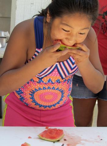 Crystal DeVore, 10, finished her watermelon slice in record time and was declared the winner in her age group Crystal DeVore, 10, finished her watermelon slice in record time and was declared the winner in her age group
