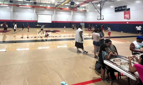 Kick Ball games take place on the court while other games and activities are offered at a Family Kick Ball Night, organized by Damon Miranda Kick Ball games take place on the court while other games and activities are offered at a Family Kick Ball Night, organized by Damon Miranda