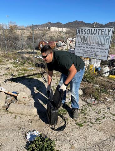 Environmental Director Christian Aceves helps collect solid waste that was dropped off during his department’s most recent community cleanup event Environmental Director Christian Aceves helps collect solid waste that was dropped off during his department’s most recent community cleanup event