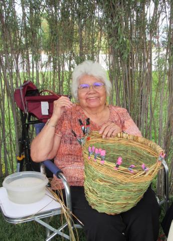 Mary Margaret Masiel works on a fresh juncus basket at the booth for the Soboba Basketweavers, which she has belonged to since it started. Her mother, Barbara Guanche was also a member Mary Margaret Masiel works on a fresh juncus basket at the booth for the Soboba Basketweavers, which she has belonged to since it started. Her mother, Barbara Guanche was also a member