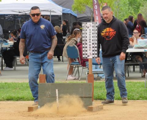 Soboba Tribal Council Sergeant-at-Arms Daniel Valdez, left, and Soboba Tribal member Shadrick Wulf watch a horseshoe land during competition Soboba Tribal Council Sergeant-at-Arms Daniel Valdez, left, and Soboba Tribal member Shadrick Wulf watch a horseshoe land during competition