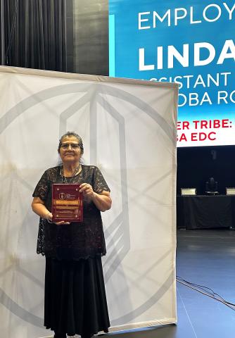 Roadrunner Express Assistant Manager Linda Whitener accepts a plaque after being named a 2025 Ron Myers Employee of the Year Roadrunner Express Assistant Manager Linda Whitener accepts a plaque after being named a 2025 Ron Myers Employee of the Year