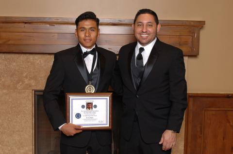 San Jacinto High School scholar-athlete Kevin Maria with NFF awards banquet master of ceremonies Pep Fernandez after receiving his plaque and medallion San Jacinto High School scholar-athlete Kevin Maria with NFF awards banquet master of ceremonies Pep Fernandez after receiving his plaque and medallion