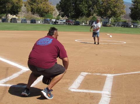 Glen Placencia throws out a ceremonial first pitch after his brother Gary and sister-in-law Tina were presented with an honorarium during the 2026 N.I.A.A. Fastpitch Softball Tournament, Sept. 18 Glen Placencia throws out a ceremonial first pitch after his brother Gary and sister-in-law Tina were presented with an honorarium during the 2026 N.I.A.A. Fastpitch Softball Tournament, Sept. 18