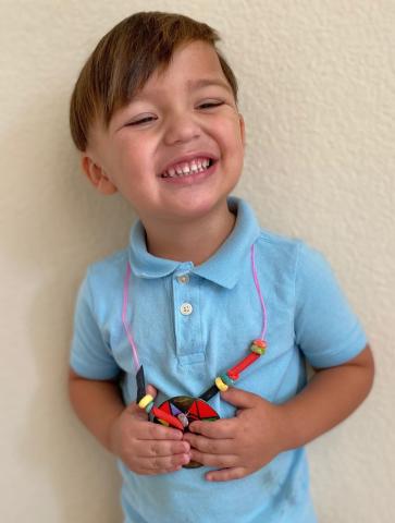 Ignacio Alcala shows off the necklace he beaded, one of several at-home activities completed by Soboba Tribal Preschool students during Native American Week Ignacio Alcala shows off the necklace he beaded, one of several at-home activities completed by Soboba Tribal Preschool students during Native American Week