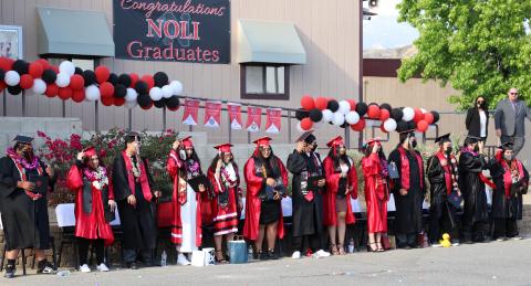 All 13 seniors from Noli Indian School get ready to turn their tassels after being certified as official graduates of the Class of 2021 by Principal Donovan Post and Tribal Council Vice Chairwoman Geneva Mojado (at right) All 13 seniors from Noli Indian School get ready to turn their tassels after being certified as official graduates of the Class of 2021 by Principal Donovan Post and Tribal Council Vice Chairwoman Geneva Mojado (at right)