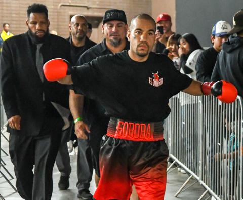 Jimmie Nunez Jr., followed by his trainer Dave Trujillo, enters the Orange Pavilion in San Bernardino last month. Photo by Ardie Crenshaw/Action Captures Media Jimmie Nunez Jr., followed by his trainer Dave Trujillo, enters the Orange Pavilion in San Bernardino last month. Photo by Ardie Crenshaw/Action Captures Media