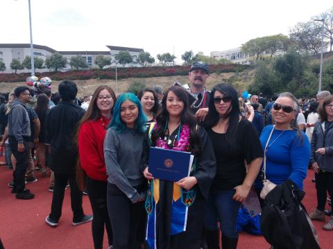 Rachelle Peterson holds her diploma surrounded by parents, grandparents and siblings after her graduation from California State University, San Marcos on May 17. Rachelle is the first student to graduate with a B.A. in American Indian Studies, a new program for the school