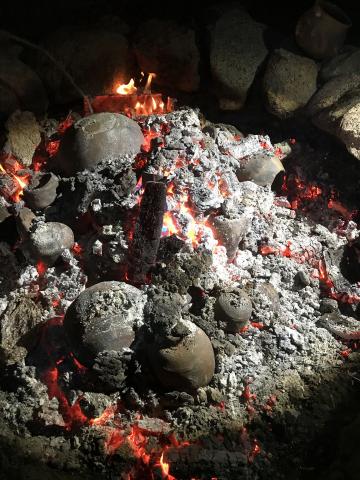 As the fire died down, the clay pots took on very distinctive looks. Photo courtesy of Tony Soares. As the fire died down, the clay pots took on very distinctive looks. Photo courtesy of Tony Soares.