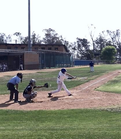 Catcher Ajay Parcero is at the plate during a recent baseball game Catcher Ajay Parcero is at the plate during a recent baseball game
