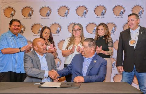 California State University, San Bernardino Provost and Vice President of Academic Affairs A. Rafik Mohammed shakes hands with Soboba Chairman Isaiah Vivanco after the ceremonial signing of an MOU. Witnessing the event, from left, are Admissions and Outreach Specialized Recruiter Alex “Panda” Armendariz, Tribal Council Vice Chairwoman Geneva Mojado, Secretary Monica Herrera, Treasurer Adona Salgado, and Sergeant-at-Arms Daniel Valdez California State University, San Bernardino Provost and Vice President of Academic Affairs A. Rafik Mohammed shakes hands with Soboba Chairman Isaiah Vivanco after the ceremonial signing of an MOU. Witnessing the event, from left, are Admissions and Outreach Specialized Recruiter Alex “Panda” Armendariz, Tribal Council Vice Chairwoman Geneva Mojado, Secretary Monica Herrera, Treasurer Adona Salgado, and Sergeant-at-Arms Daniel Valdez