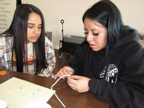 Aleksia Rosas, left, gets some one-on-one beading pointers from instructor Lexi Lopez Aleksia Rosas, left, gets some one-on-one beading pointers from instructor Lexi Lopez