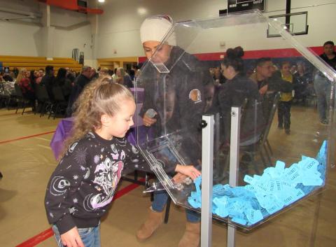 Preschooler Love Salgado-Flores gets help from Soboba Tribal Council Vice Chairwoman Geneva Mojado to select the winning ticket for the 50/50 drawing Preschooler Love Salgado-Flores gets help from Soboba Tribal Council Vice Chairwoman Geneva Mojado to select the winning ticket for the 50/50 drawing