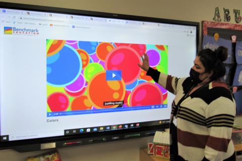 Soboba Tribal Preschool teacher Ana Garcia shows a sample lesson about colors using the interactive whiteboard and Benchmark Education curriculum
