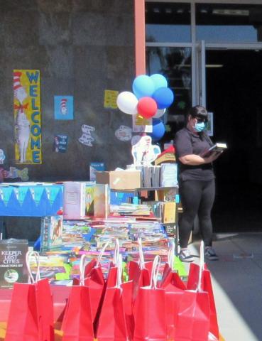 Jacquelin Phillips from Noli Indian School reviews some of the books purchased for adults that have become part of the school’s bookmobile service so entire families can do more reading Jacquelin Phillips from Noli Indian School reviews some of the books purchased for adults that have become part of the school’s bookmobile service so entire families can do more reading