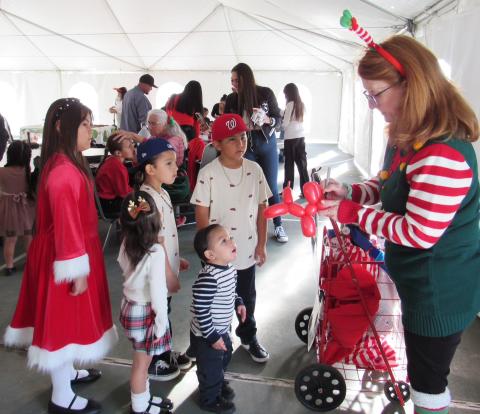 Balloon artist Freckles creates animals and other things to the delight of children at the Soboba Tribal Christmas Party Balloon artist Freckles creates animals and other things to the delight of children at the Soboba Tribal Christmas Party