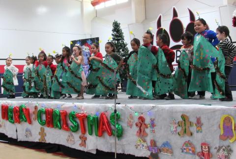Pre-K students rock around the Christmas tree during their winter performance, Dec. 20 Pre-K students rock around the Christmas tree during their winter performance, Dec. 20