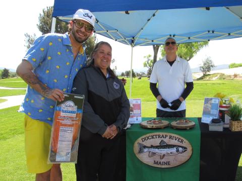 Ducktrap River vendor reps Daniel McCarthy, left, and John Fovos welcome the tournament’s Volunteer Coordinator Tara Placencia to their booth. Their smoked salmon is available at the Soboba Casino Resort restaurants. Soboba Band of Luiseño Indians photo Ducktrap River vendor reps Daniel McCarthy, left, and John Fovos welcome the tournament’s Volunteer Coordinator Tara Placencia to their booth. Their smoked salmon is available at the Soboba Casino Resort restaurants. Soboba Band of Luiseño Indians photo