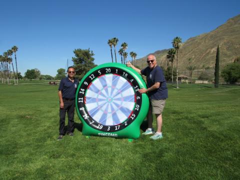 Volunteers Jose Farias, left, and Wayne Disher, representing Haven Pet Center, help players with the Dart Board Chip game on Hole 1 at the Soboba Springs Golf Course. Soboba Band of Luiseño Indians photo Volunteers Jose Farias, left, and Wayne Disher, representing Haven Pet Center, help players with the Dart Board Chip game on Hole 1 at the Soboba Springs Golf Course. Soboba Band of Luiseño Indians photo