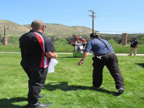 Daniel Salgado, center, does well at the Football Pass on Hole 12 as Hemet Youth Wrestling volunteers Joe Ownby, left, and RJ Anderson watch. Soboba Band of Luiseño Indians photo Daniel Salgado, center, does well at the Football Pass on Hole 12 as Hemet Youth Wrestling volunteers Joe Ownby, left, and RJ Anderson watch. Soboba Band of Luiseño Indians photo