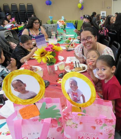 Elena Vega-Castello with her twins, Paa’kal and Kut, and the bags of gifts they made for her Elena Vega-Castello with her twins, Paa’kal and Kut, and the bags of gifts they made for her