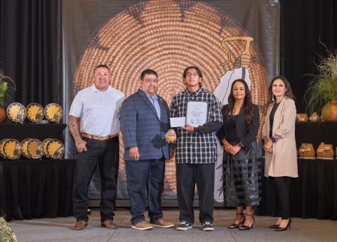 Members of Soboba Tribal Council congratulate each student as they come to the stage to accept their recognition gifts. From left, Daniel Valdez, Isaiah Vivanco, Outstanding student Jeffrey Lee Arres, Geneva Mojado and Monica Herrera Members of Soboba Tribal Council congratulate each student as they come to the stage to accept their recognition gifts. From left, Daniel Valdez, Isaiah Vivanco, Outstanding student Jeffrey Lee Arres, Geneva Mojado and Monica Herrera
