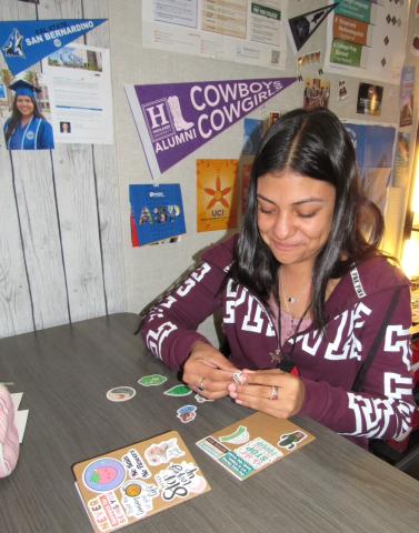 Shanee Demara personalizes two journals, one for drawing and one for writing, during a lunchtime visit to the Wellness Center Shanee Demara personalizes two journals, one for drawing and one for writing, during a lunchtime visit to the Wellness Center