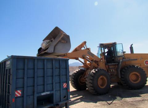 Ray Peterson uses a skip loader to dump general waste into one of the 40-yard bins used during the most recent community cleanup day at the Soboba Reservation Ray Peterson uses a skip loader to dump general waste into one of the 40-yard bins used during the most recent community cleanup day at the Soboba Reservation