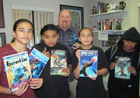 Noli Indian School Principal Donovan Post with a few members of the Comic Book Club showing off some of their favorite titles. From left, Frank Moreno, Xavier Hernandez, Carmel Valenzuella IV and Max Hernandez Noli Indian School Principal Donovan Post with a few members of the Comic Book Club showing off some of their favorite titles. From left, Frank Moreno, Xavier Hernandez, Carmel Valenzuella IV and Max Hernandez
