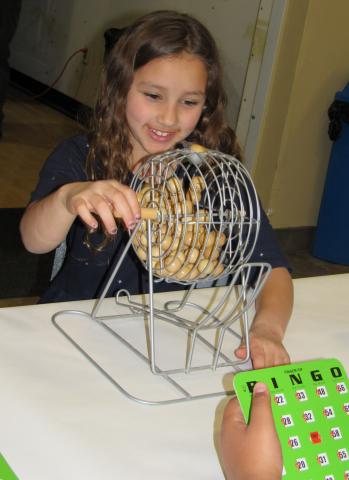 Noyaaykit Silvas, 8, helps with bingo games for the younger children during a social gathering for Soboba tribal members on March 9 Noyaaykit Silvas, 8, helps with bingo games for the younger children during a social gathering for Soboba tribal members on March 9