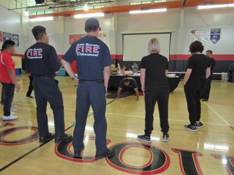 A push-up contest was held during the third annual Community Health Fair at the Soboba Sports Complex on March 11. Soboba Fire Captain Jacob Briones is cheered on by fellow firefighters and other guests A push-up contest was held during the third annual Community Health Fair at the Soboba Sports Complex on March 11. Soboba Fire Captain Jacob Briones is cheered on by fellow firefighters and other guests
