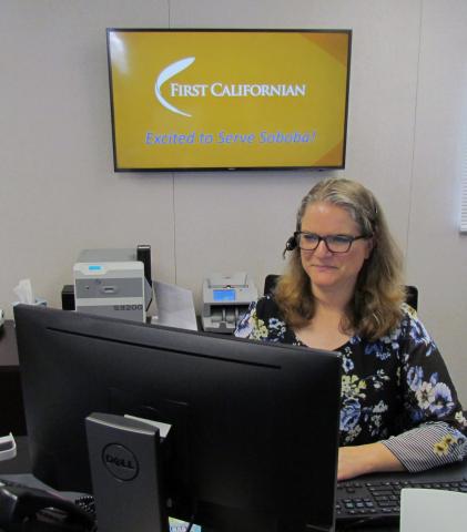 First Californian teller Darlene Owen kept busy during the grand opening of the Soboba Branch First Californian teller Darlene Owen kept busy during the grand opening of the Soboba Branch
