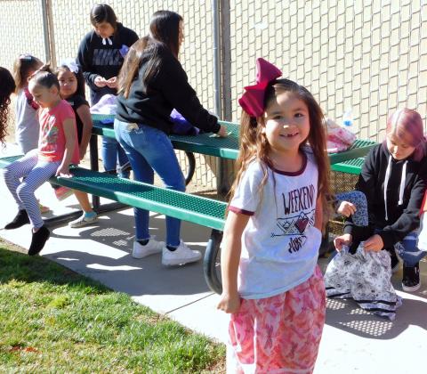 Maylee Masiel is excited to show off her new camp dress as others receive theirs when Noli Indian School dressmakers delivered them to the kindergarteners on March 11 Maylee Masiel is excited to show off her new camp dress as others receive theirs when Noli Indian School dressmakers delivered them to the kindergarteners on March 11