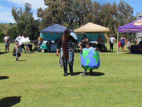 Karen Meade helps her four-year-old son Anastacio Basquez show off his Earth Boy costume during a recyclable fashion show put on by students of the Soboba Tribal Preschool Karen Meade helps her four-year-old son Anastacio Basquez show off his Earth Boy costume during a recyclable fashion show put on by students of the Soboba Tribal Preschool