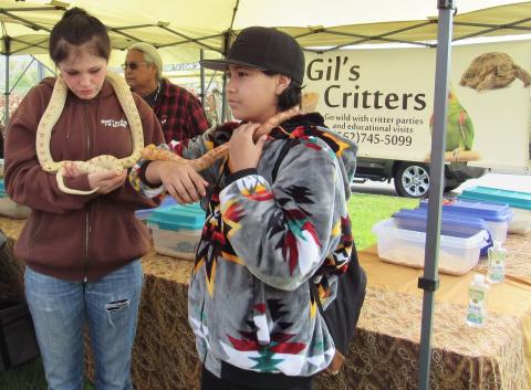 Soboba Tribal Earth Day attendees Serena Hawk, left, and Angel Reyes interact with different snakes as Gil’s Critters owner Gilbert Flores, center, shares information on other critters that he has at his vendor booth Soboba Tribal Earth Day attendees Serena Hawk, left, and Angel Reyes interact with different snakes as Gil’s Critters owner Gilbert Flores, center, shares information on other critters that he has at his vendor booth