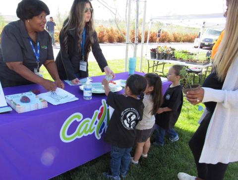 Hosea Jones, left, and Taylor Hart from CalFresh offer ideas about planting healthy fruits and vegetables Hosea Jones, left, and Taylor Hart from CalFresh offer ideas about planting healthy fruits and vegetables