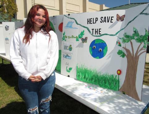 Nataly Lemus, a junior at Noli Indian School, with poster she and her Biology classmates made for the Earth Day poster contest, sponsored by STED Nataly Lemus, a junior at Noli Indian School, with poster she and her Biology classmates made for the Earth Day poster contest, sponsored by STED