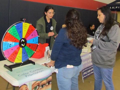 Tatiana Navarro, left, from the Hemet Eye Care Center of Optometry discusses the importance of eye care with visitors to the second annual Community Health Fair on March 7 at the Soboba Sports Complex Tatiana Navarro, left, from the Hemet Eye Care Center of Optometry discusses the importance of eye care with visitors to the second annual Community Health Fair on March 7 at the Soboba Sports Complex