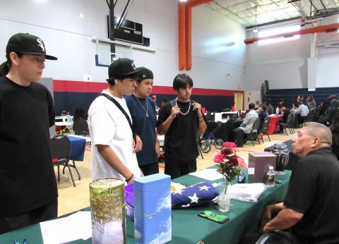 Students engage with Inland Memorial Funeral Care’s Funeral Arranger Robert Young, seated at right, who explains the nature of his business Students engage with Inland Memorial Funeral Care’s Funeral Arranger Robert Young, seated at right, who explains the nature of his business