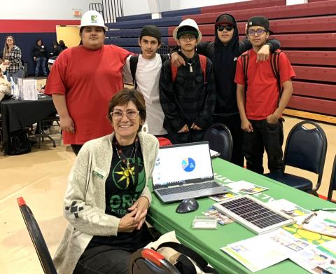 Lisa Castilone, from GRID Alternatives IE, shares information and hardhats with students attending the Noli Career and College Fair at the Soboba Sports Complex, Nov. 28 Lisa Castilone, from GRID Alternatives IE, shares information and hardhats with students attending the Noli Career and College Fair at the Soboba Sports Complex, Nov. 28