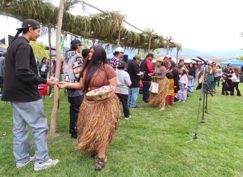 $ovóova Po’$wáamay candidates Raya Salgado and Su’la Arviso gift Torres Martinez bird singers with sage bundles and tobacco pouches as a thank you for their appearance at the Soboba Fiesta $ovóova Po’$wáamay candidates Raya Salgado and Su’la Arviso gift Torres Martinez bird singers with sage bundles and tobacco pouches as a thank you for their appearance at the Soboba Fiesta
