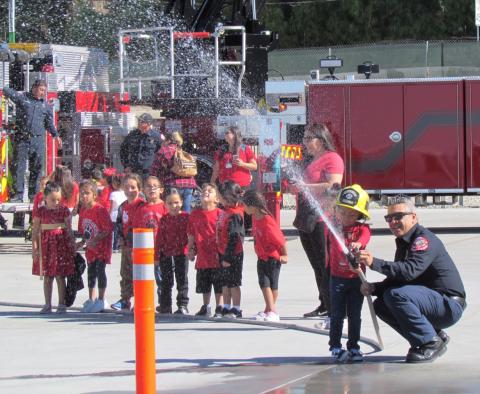 Soboba Fire Department’s Richard Gilmartin lets each Soboba Tribal Preschool student have a turn at spraying a fire hose during their field trip on Oct. 11. Soboba Fire Department’s Richard Gilmartin lets each Soboba Tribal Preschool student have a turn at spraying a fire hose during their field trip on Oct. 11.