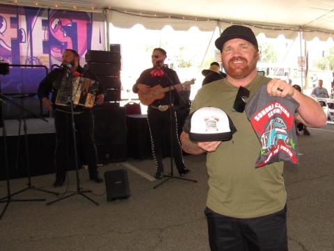 Randy Taylor of Beaumont wins some swag from the axe-throwing contest, overseen by KOLA 99.9. At the SCR Food Truck Fiesta for the first time, he said, “It’s awesome.” Randy Taylor of Beaumont wins some swag from the axe-throwing contest, overseen by KOLA 99.9. At the SCR Food Truck Fiesta for the first time, he said, “It’s awesome.”