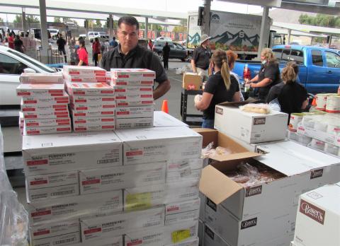 Soboba Casino Resort Assistant General Manager Jason Cozart, center, takes on pumpkin pie duty during the Soboba turkey giveaway event for San Jacinto Unified School District families. About 100 volunteers were on hand at San Jacinto High School’s parking lot to greet and treat some of the district’s neediest families on Nov. 19 Soboba Casino Resort Assistant General Manager Jason Cozart, center, takes on pumpkin pie duty during the Soboba turkey giveaway event for San Jacinto Unified School District families. About 100 volunteers were on hand at San Jacinto High School’s parking lot to greet and treat some of the district’s neediest families on Nov. 19