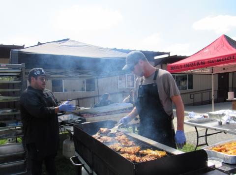 Jacob Rivera, left, and XX help prepare grilled meats during Noli Indian School’s 17th annual Gathering of the People Jacob Rivera, left, and XX help prepare grilled meats during Noli Indian School’s 17th annual Gathering of the People