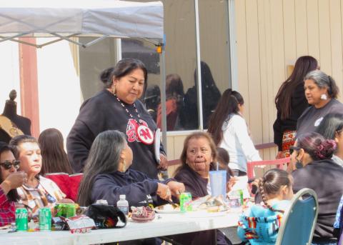 Millie Arres, standing, chats with Soboba Tribal members while wearing the beaded medallion she was gifted with by Tashina Miranda Ornelas at the Gathering of the People Millie Arres, standing, chats with Soboba Tribal members while wearing the beaded medallion she was gifted with by Tashina Miranda Ornelas at the Gathering of the People