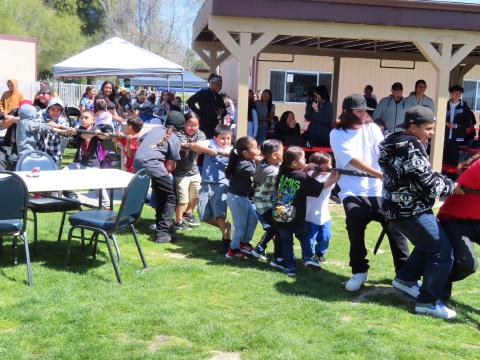It is boys vs. girls during a Tug-of-war event at the annual Gathering of the People, and these are the boys that won after a hard fight It is boys vs. girls during a Tug-of-war event at the annual Gathering of the People, and these are the boys that won after a hard fight