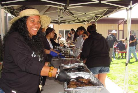 Noli math teacher Kekai Bryant-Williams welcomes guests through the buffet line at the 18th annual Gathering of the People, April 3 Noli math teacher Kekai Bryant-Williams welcomes guests through the buffet line at the 18th annual Gathering of the People, April 3