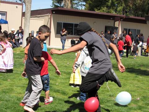 Kolókolomay Temanxwanvish, at right, shows the outstanding footwork that earned him the win in a balloon popping contest Kolókolomay Temanxwanvish, at right, shows the outstanding footwork that earned him the win in a balloon popping contest